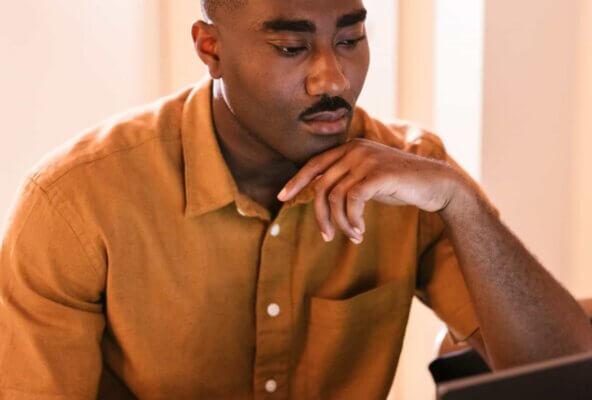 man looking at computer screen