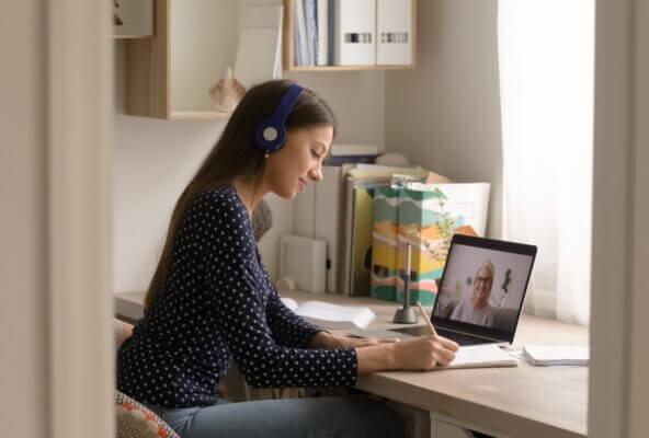 physician and patient speaking through telehealth