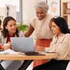 Prospective patients look at a laptop computer admiring a dentist office’s effective dental website design