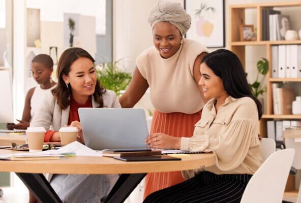 Prospective patients look at a laptop computer admiring a dentist office’s effective dental website design