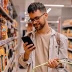 Person looks at digital intake forms on smartphone as part of patient consumerism