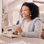 Woman on phone scheduling patients for appointments.