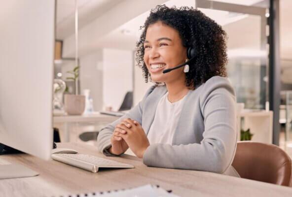 Woman on phone scheduling patients for appointments.