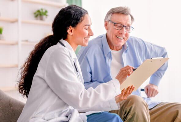 Physician and patient discuss Men's Health Month as part of June healthcare observances