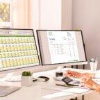 Person uses calculator after reading June 2025 revenue cycle management healthcare news