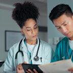 Medical practice team discusses July 2025 RCM healthcare news