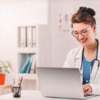 Doctor has telehealth appointment with patient while implementing AI in telemedicine