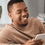 Man looking at tablet learning about website design for medical practices.