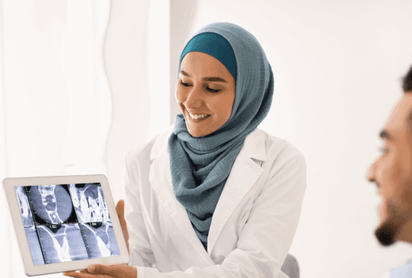 Physician ponders healthcare practice growth while working with a patient