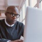 Healthcare professional reads about licenses to start your own medical business