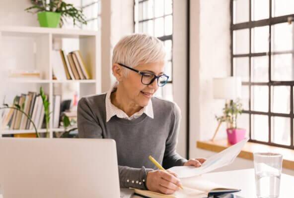 Image of self-employed physician looking at paperwork