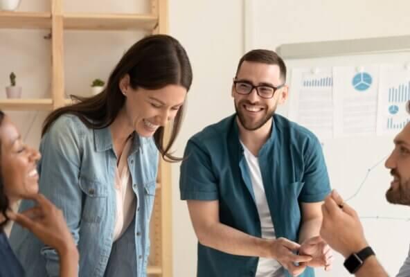 medical front office staff smiling and collaborating