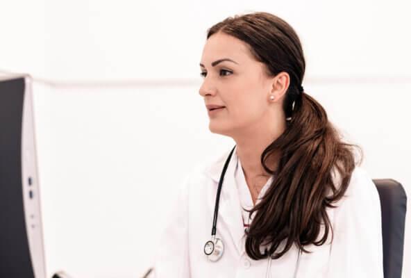 Physician reading about why documentation is important for medical coding