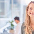 Manager smiles after learning strategies to maximize medical billing company cash flow