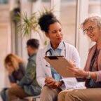 A doctor supporting patient health insurance financial literacy.