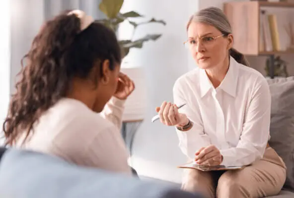 Client speaking with provider experiencing mental health therapist burnout
